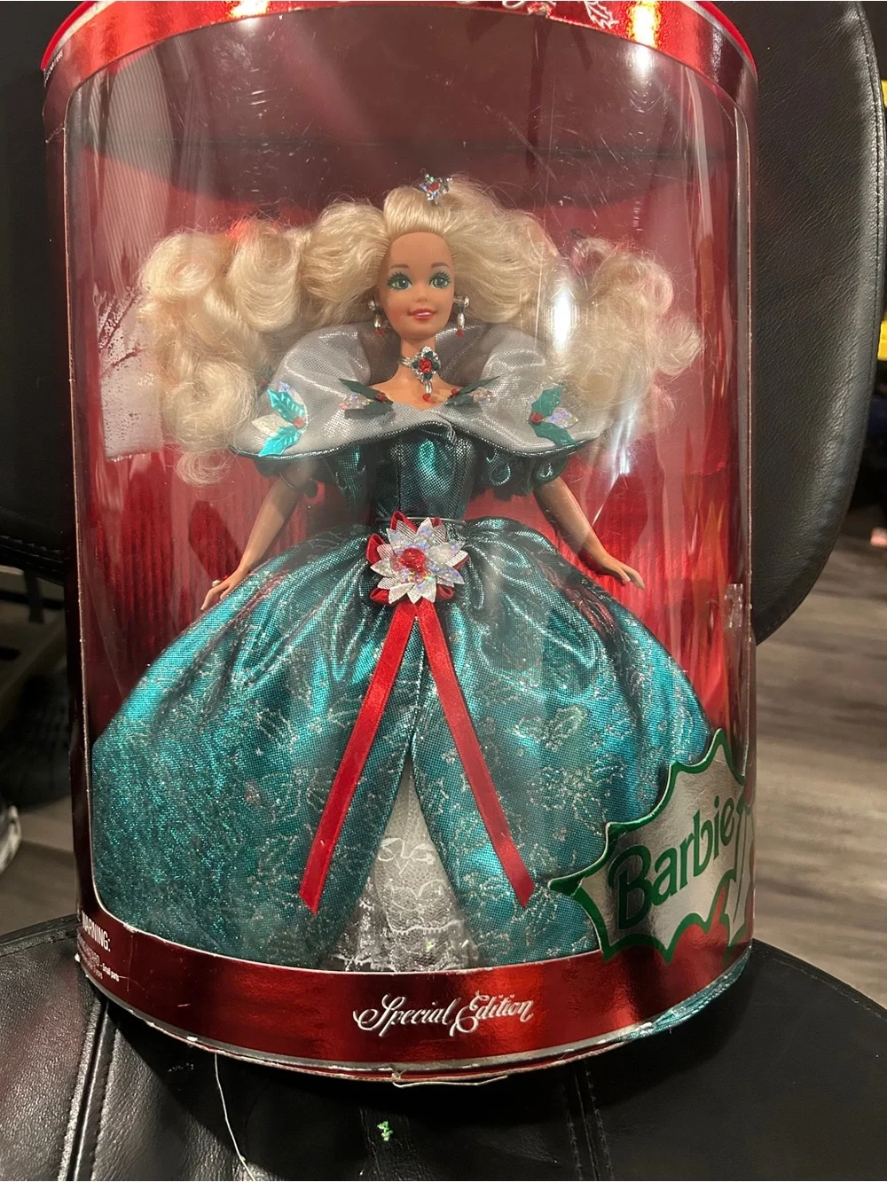 1995 Special Edition Happy Holidays Barbie by Mattel, featuring a distinct emera
